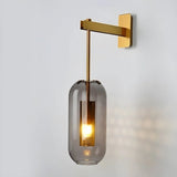 modern-vadim-glass-wall-sconce-with-perforated-metal-cage-and-brass-finish-for-luxury-interiors