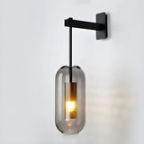modern-vadim-glass-wall-sconce-with-perforated-metal-cage-and-brass-finish-for-luxury-interiors