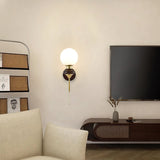 mid-century-walnut-wood-wall-sconce-lighting-with-white-glass-shade-and-pull-cord-switch