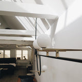 modern-minimalist-branch-chandelier-with-brass-bird-figures-and-white-glass-spheres