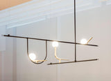 modern-minimalist-branch-chandelier-with-brass-bird-figures-and-white-glass-spheres