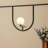 modern-minimalist-branch-chandelier-with-brass-bird-figures-and-white-glass-spheres