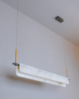 modern-linear-alabaster-led-pendant-light-with-brass-architectural-accents-for-home-dining
