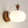 modern-walnut-wood-wall-sconce-with-globe-glass-shade-mid-century-interior-vanity-lighting