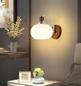 modern-walnut-wood-wall-sconce-with-globe-glass-shade-mid-century-interior-vanity-lighting
