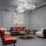 artistic-gingko-branch-chandelier-with-handcrafted-white-ceramic-leaves-and-gold-finish