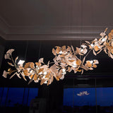 artistic-gingko-branch-chandelier-with-handcrafted-white-ceramic-leaves-and-gold-finish