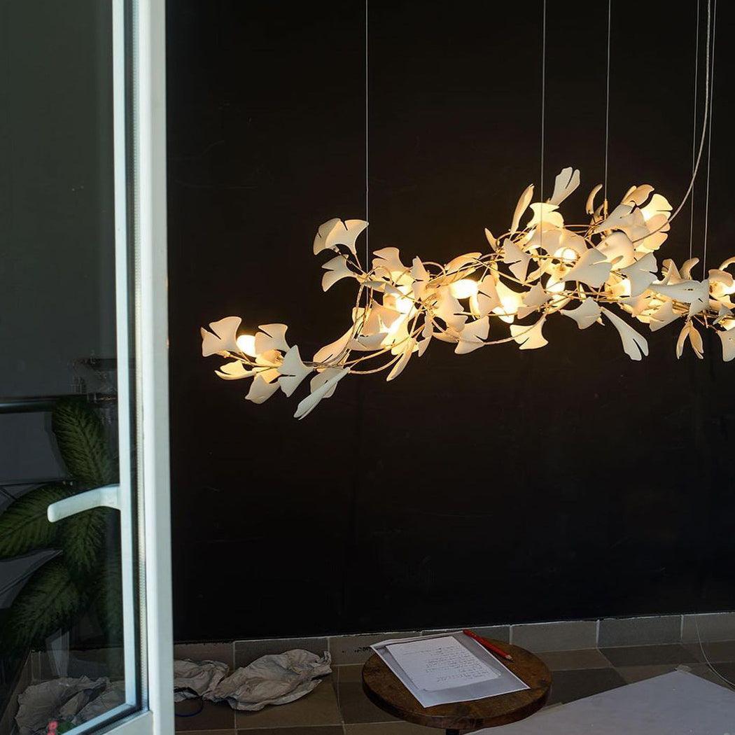 artistic-gingko-branch-chandelier-with-handcrafted-white-ceramic-leaves-and-gold-finish