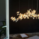 artistic-gingko-branch-chandelier-with-handcrafted-white-ceramic-leaves-and-gold-finish
