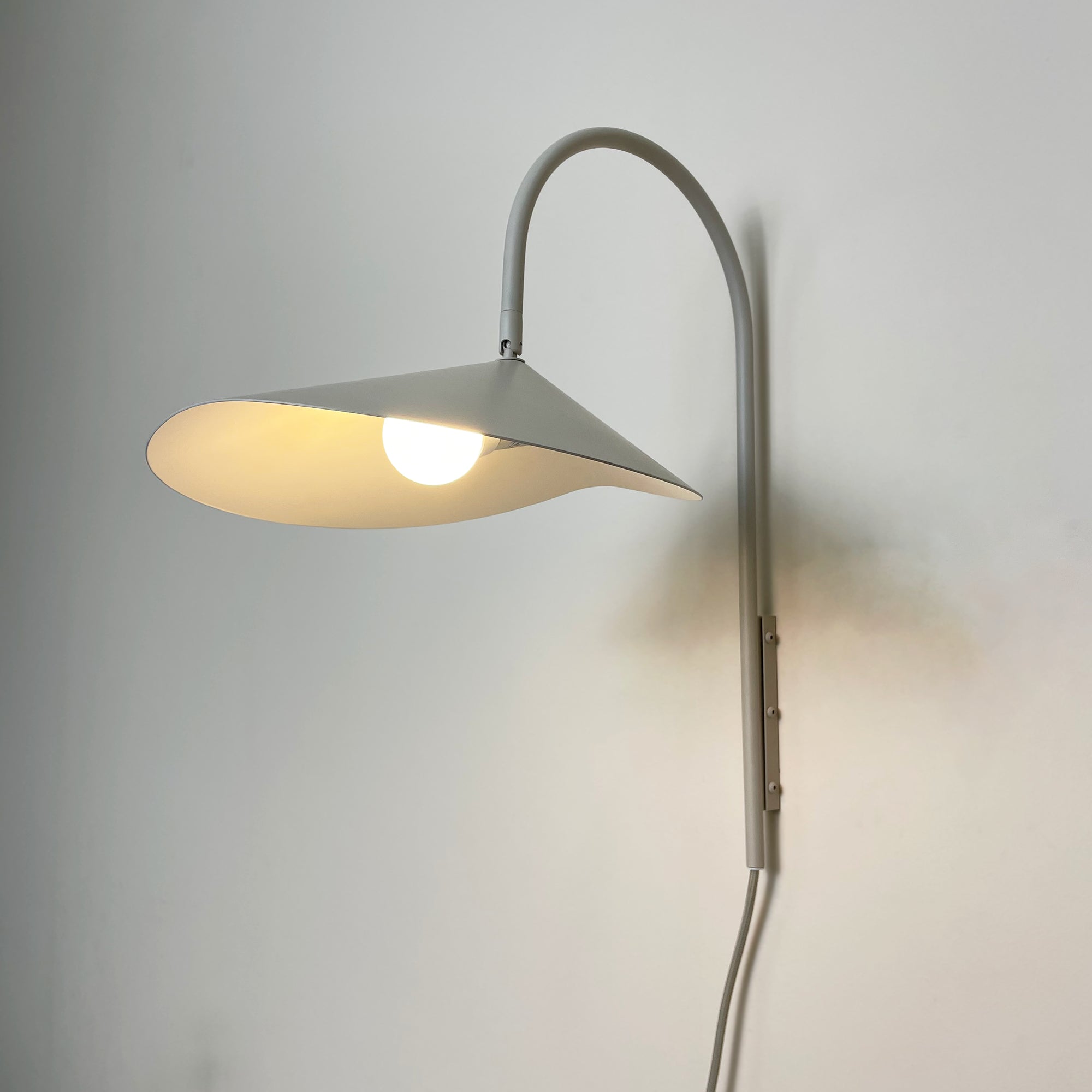 Arum Swivel Bracket Wall Lamp with Adjustable Curved Shade for Modern Interiors