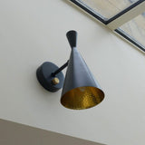 modern-beat-metal-wall-sconce-with-gold-interior-for-bedroom-and-living-room