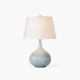 blue-sculptural-ceramic-table-lamp-with-white-fabric-shade-for-contemporary-living-room-decor