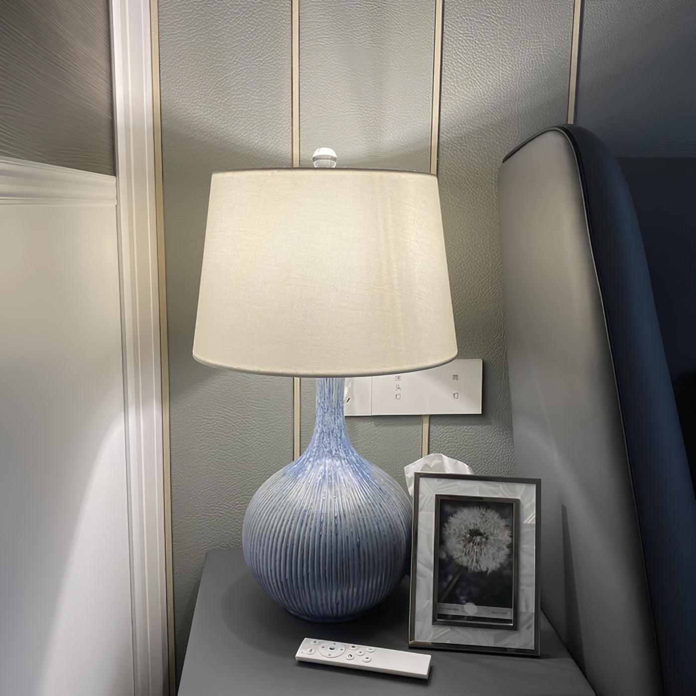 blue-sculptural-ceramic-table-lamp-with-white-fabric-shade-for-contemporary-living-room-decor