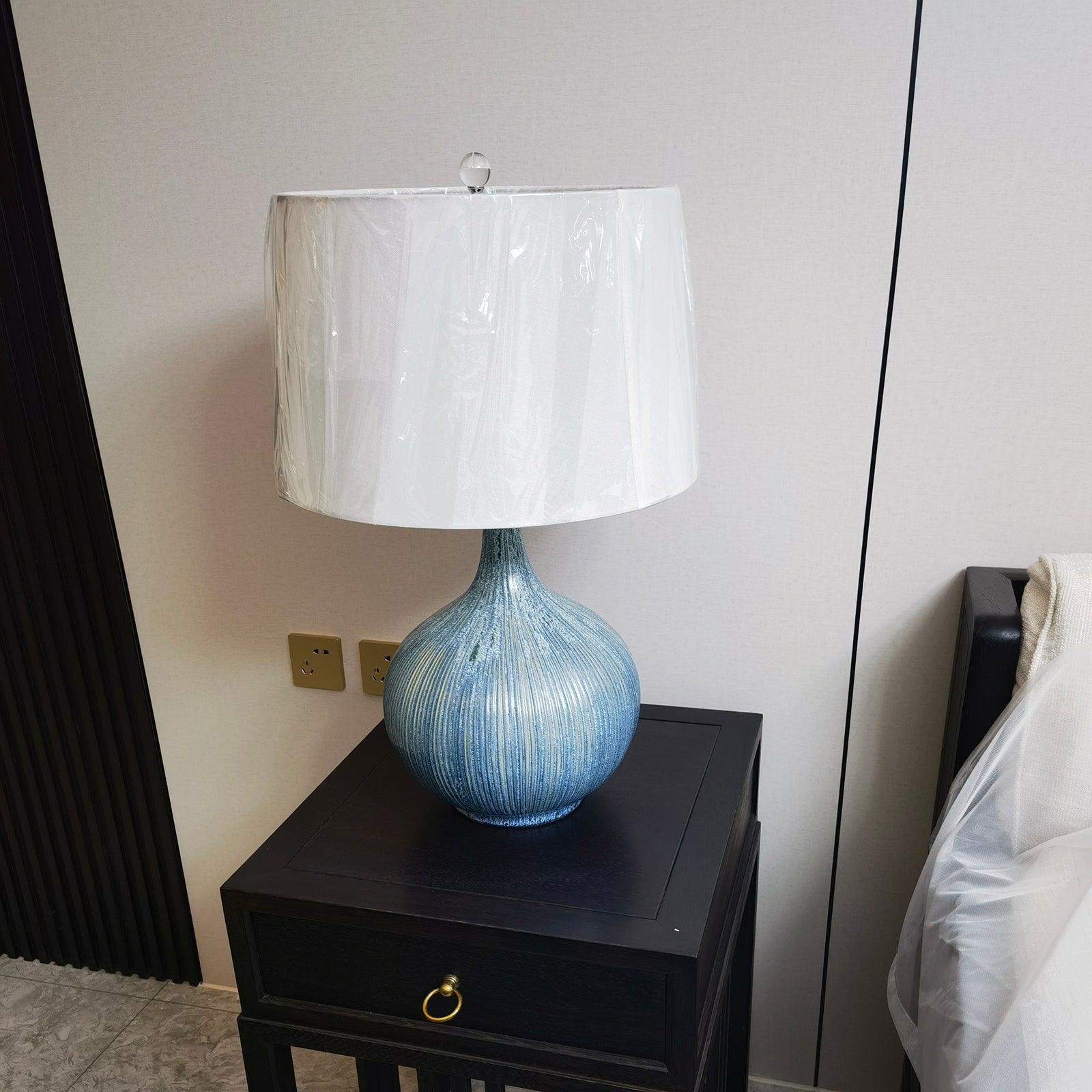 blue-sculptural-ceramic-table-lamp-with-white-fabric-shade-for-contemporary-living-room-decor