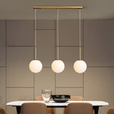 Contemporary Gold Globe Pendant Lighting with White Frosted Glass Shades for Kitchen