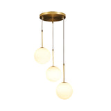 Contemporary Gold Globe Pendant Lighting with White Frosted Glass Shades for Kitchen