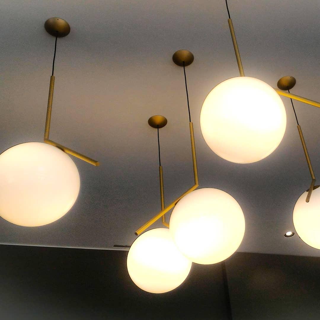 Contemporary Minimalist Equilibrium Glass Globe Pendant Light with Brass and Black Finishes
