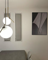 Contemporary Minimalist Equilibrium Glass Globe Pendant Light with Brass and Black Finishes