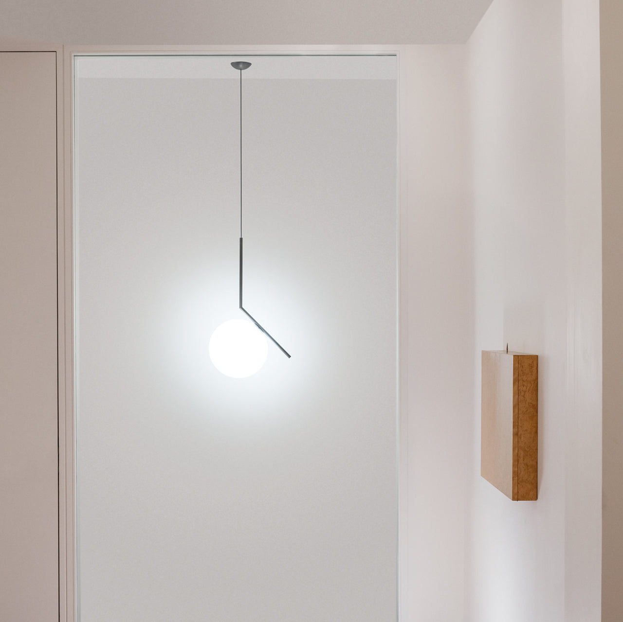 Contemporary Minimalist Equilibrium Glass Globe Pendant Light with Brass and Black Finishes