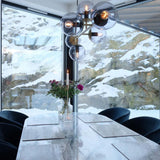 Contemporary Orb Glass Globe Vertical Pendant Light Brass and Glass Multi Light Fixture