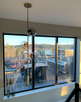 Contemporary Orb Glass Globe Vertical Pendant Light Brass and Glass Multi Light Fixture