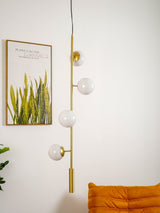 Contemporary Orb Glass Globe Vertical Pendant Light Brass and Glass Multi Light Fixture