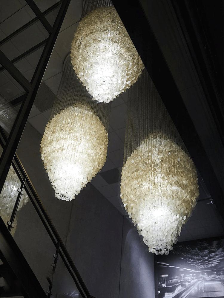 Elegant Coastal Shell Waterfall Chandelier with Cascading White Shell Discs for High Ceiling Spaces
