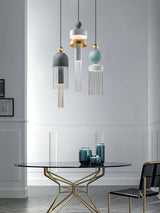 Elegant Metal Tassel Pendant Light with Integrated LED and Clear Glass Shade for Modern Interiors