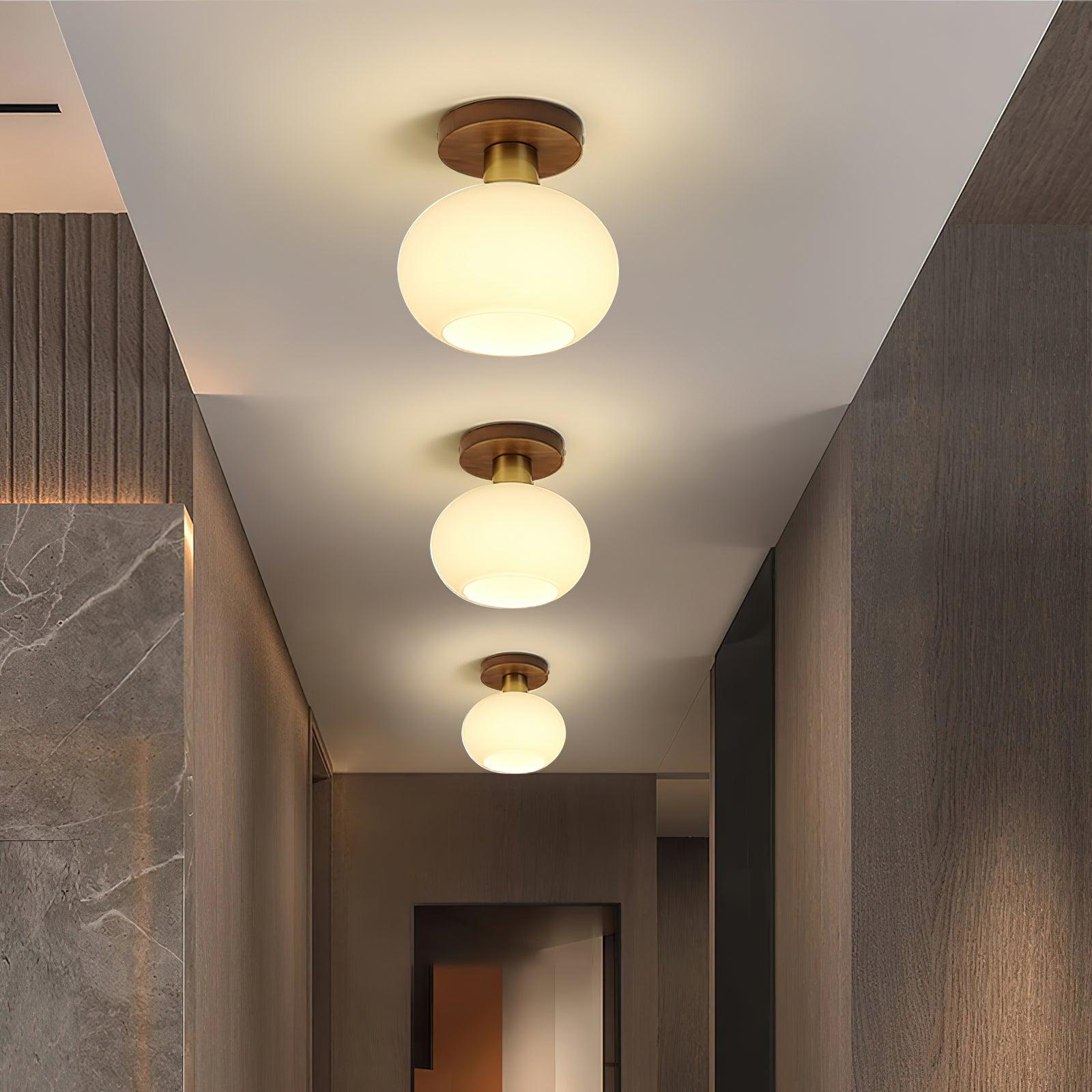 elegant-white-shell-ceiling-lamp-with-black-walnut-wood-base-and-copper-accents