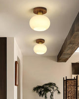 elegant-white-shell-ceiling-lamp-with-black-walnut-wood-base-and-copper-accents