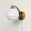 Gatsby Art Deco Style Wall Sconce with White Glass Shade and Metal Finish