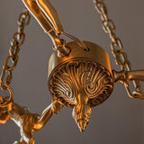 italian-aged-brass-putti-statuette-pendant-light-with-frosted-glass-globes
