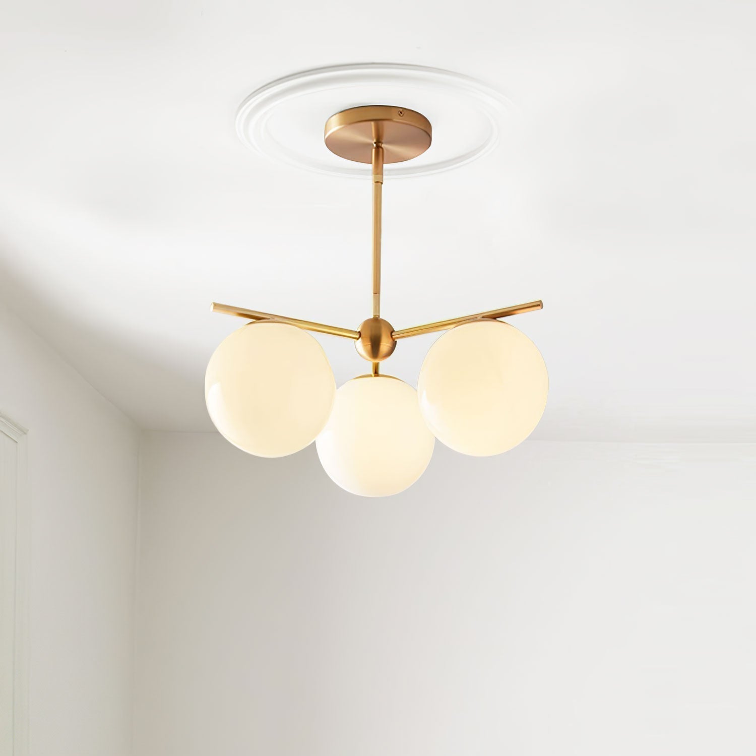Mid Century Modern Sphere and Stem Chandelier with White Glass Globes and Brass Finish