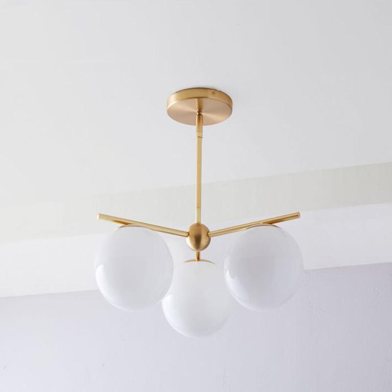Mid Century Modern Sphere and Stem Chandelier with White Glass Globes and Brass Finish