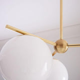 Mid Century Modern Sphere and Stem Chandelier with White Glass Globes and Brass Finish