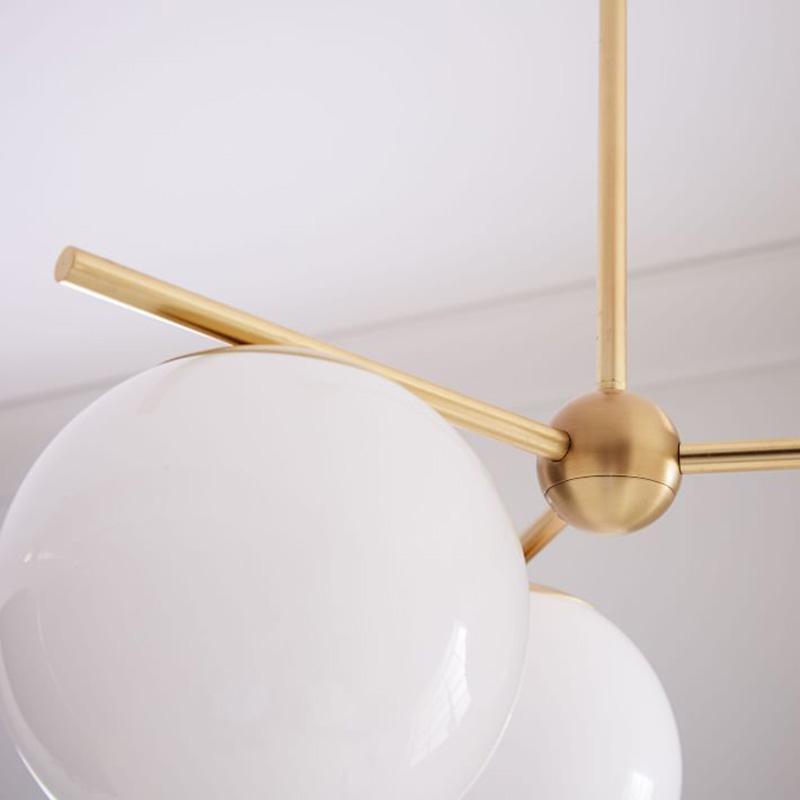 Mid Century Modern Sphere and Stem Chandelier with White Glass Globes and Brass Finish
