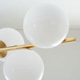 Mid Century Modern Sphere and Stem Chandelier with White Glass Globes and Brass Finish