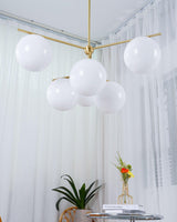 Mid Century Modern Sphere and Stem Chandelier with White Glass Globes and Brass Finish
