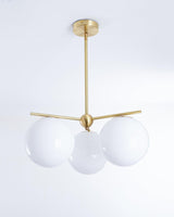 Mid Century Modern Sphere and Stem Chandelier with White Glass Globes and Brass Finish