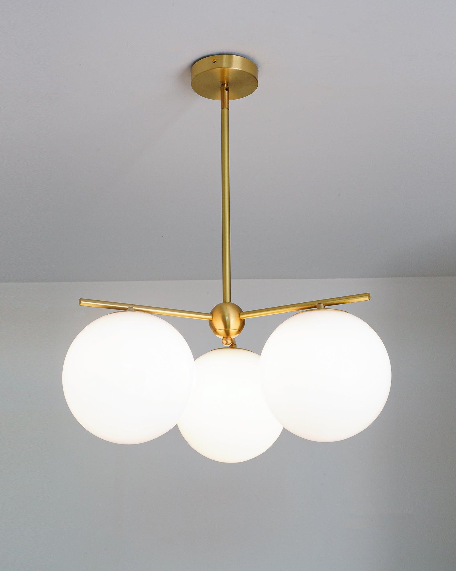 Mid Century Modern Sphere and Stem Chandelier with White Glass Globes and Brass Finish