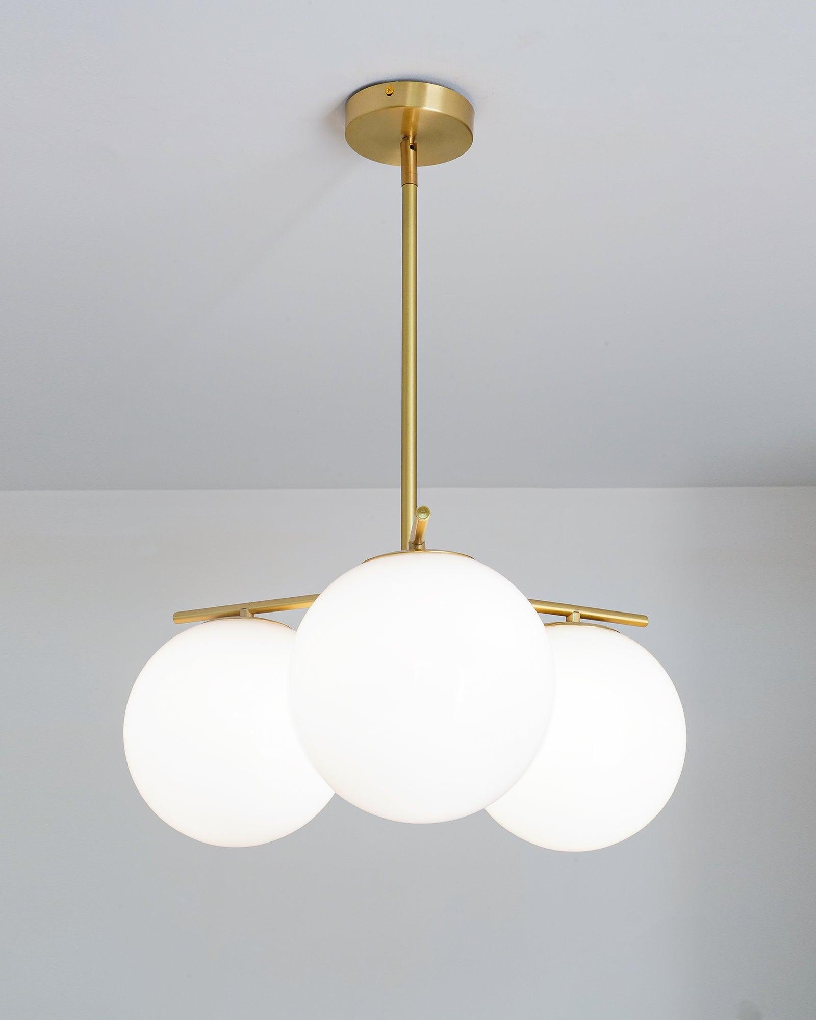 Mid Century Modern Sphere and Stem Chandelier with White Glass Globes and Brass Finish
