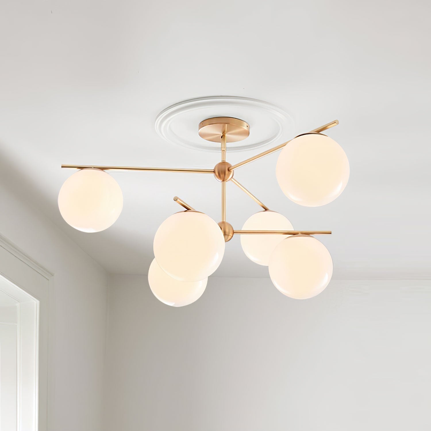 Mid Century Modern Sphere and Stem Chandelier with White Glass Globes and Brass Finish