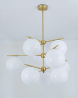 Mid Century Modern Sphere and Stem Chandelier with White Glass Globes and Brass Finish