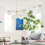 Mid Century Modern Sphere and Stem Chandelier with White Glass Globes and Brass Finish