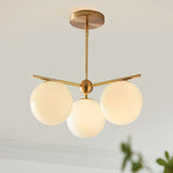 Mid Century Modern Sphere and Stem Chandelier with White Glass Globes and Brass Finish