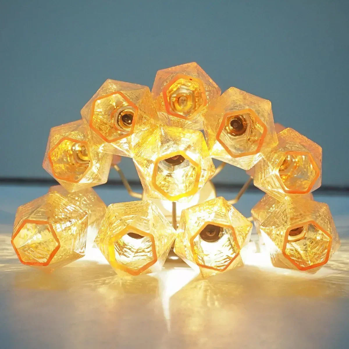 modern-amber-murano-glass-poliedri-sconce-pair-with-brass-finish-for-luxury-interiors