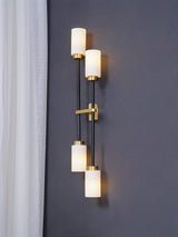 Modern Asymmetric Brass Wall Sconce with Cylindrical Glass Shades for Luxury Interiors