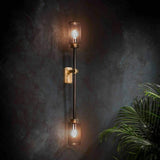 Modern Asymmetric Brass Wall Sconce with Cylindrical Glass Shades for Luxury Interiors