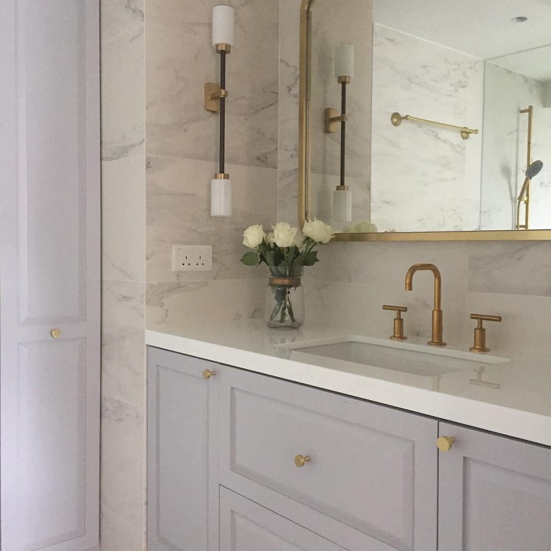 Modern Asymmetric Brass Wall Sconce with Cylindrical Glass Shades for Luxury Interiors