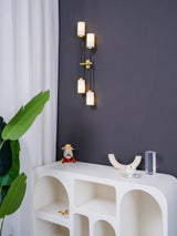 Modern Asymmetric Brass Wall Sconce with Cylindrical Glass Shades for Luxury Interiors
